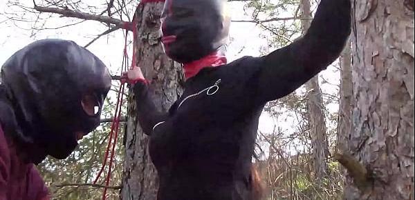  Tied to a tree on a sexy outfit, masked and outdoor deepthroat with no mercy